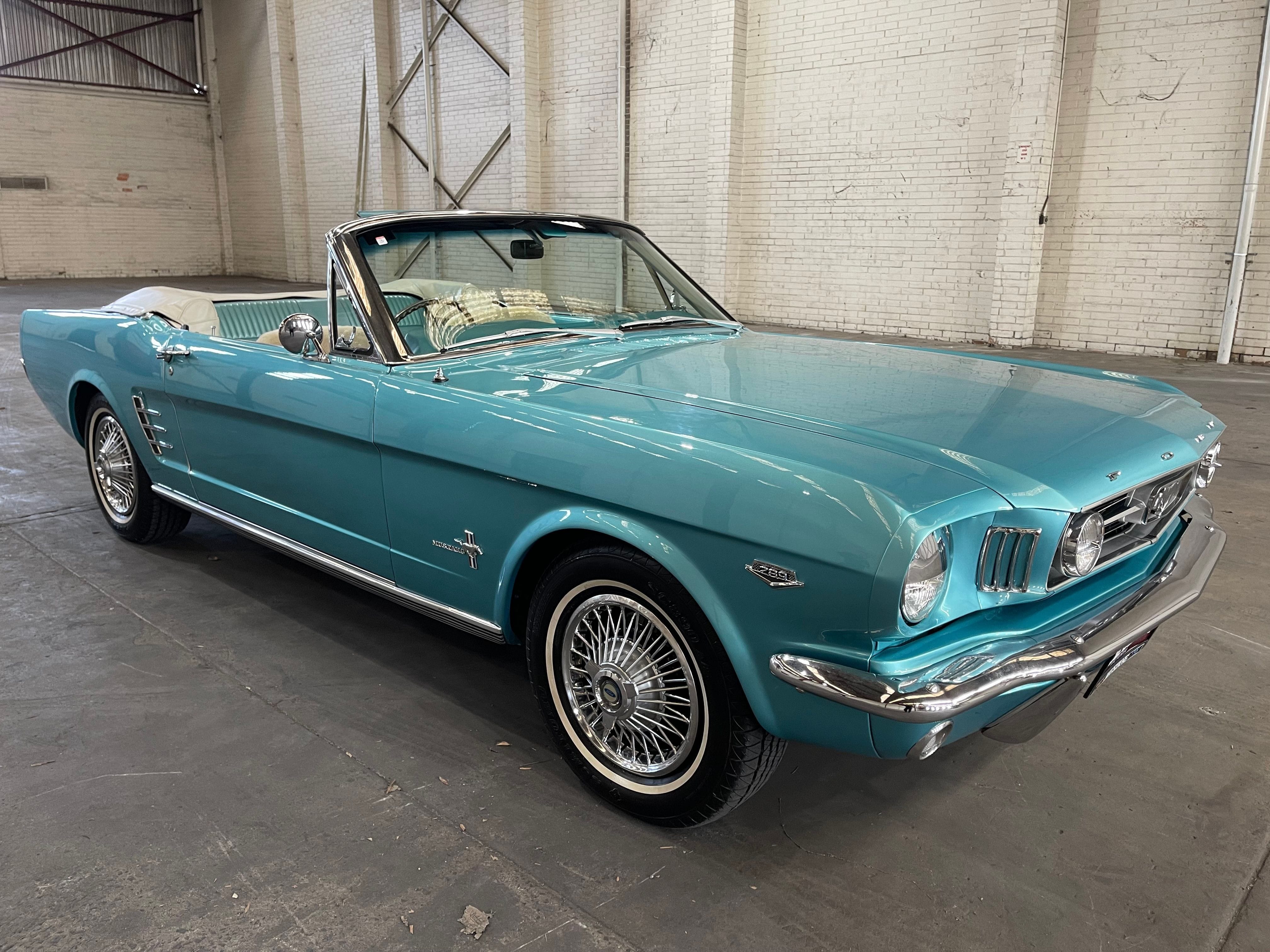 Light Blue 1966 Ford Mustang Convertible With The Hood Down.